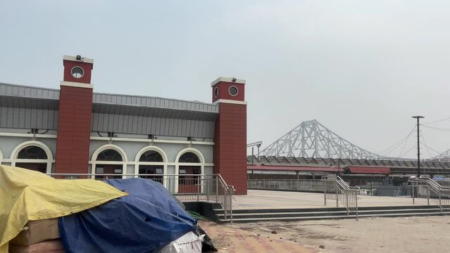 Metro railway station at Howrah with Howrah Bridge in the background.