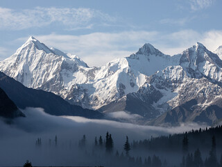Snow-capped mountains in the morning mist