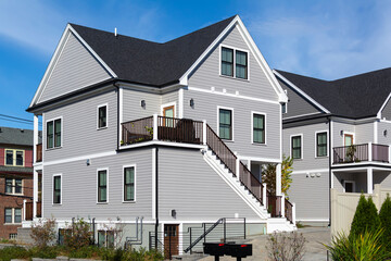 Newly built two-story family home with cross-gable roof in Brighton, MA, USA