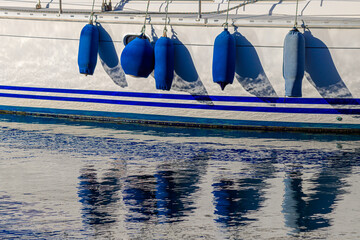 Boat with blue fenders
