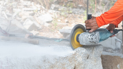 Workers are working, cutting marble cutter