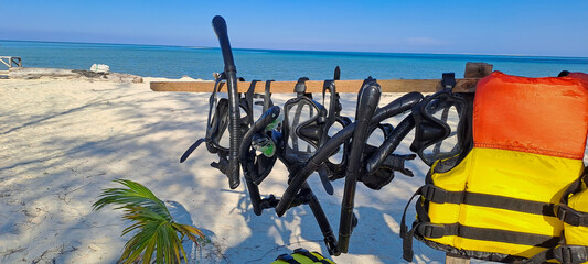 Rental snorkels hanging at a shop or service for tourist on the Sea	
