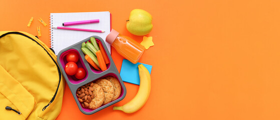 Backpack, stationery and lunch box with tasty food on orange background
