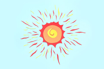 Bright sun with rays made of paper on blue background