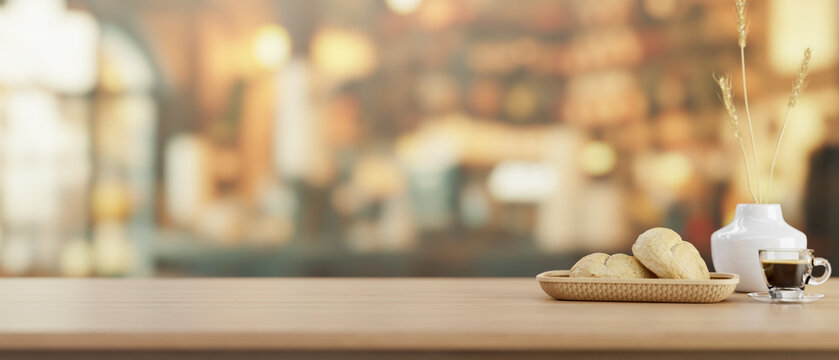 A close-up image of a space for display products on a wooden table in a cosy, vintage coffee shop.