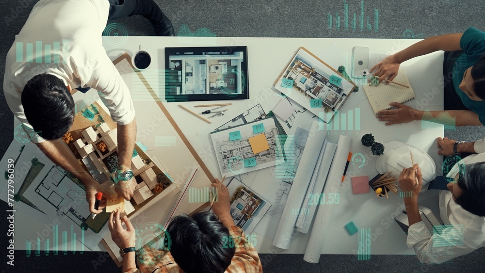 Aufkleber top down aerial view of team looking at blueprint and talking about financial chart or investment st