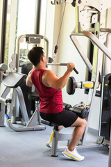 Asian man exercise in the gym. Healthy and Lifestyle Concept.Strength and motivation, sport, fitness goal