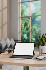 Fototapeta premium A white-screen digital tablet and accessories on a wooden table in a contemporary living room.