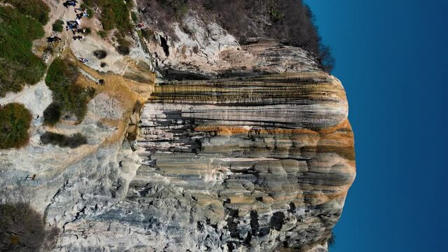 vertical view of hierve el agua waterfall, close view zoom out movement drone sight in oaxaca, mexico