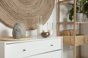 Tibetan bowl with candles on commode in living room