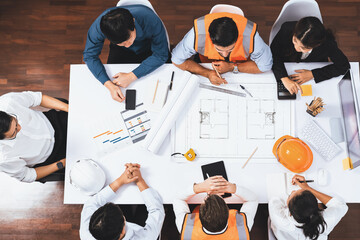 Top view banner of diverse group of civil engineer and client working together on architectural...