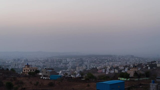 Holygrail timelapse of sunset over city with city nightscapes. 4K60fps. Golden hour timelapse. You can the city lights turing on as day turns into night.