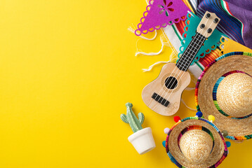 Celebrating Cinco de Mayo. Top view of celebratory props, including traditional hats, a small...