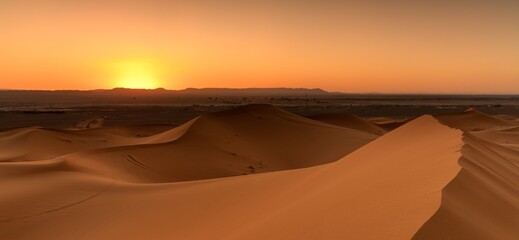 panorama view of the sand dunes at Erg Chebbi in Morocco at sunset