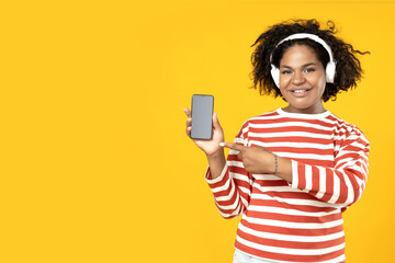 A young African American woman with a smartphone in her hands