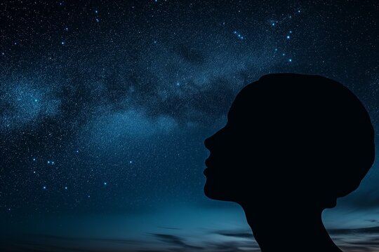 human head profile blended with starry night sky