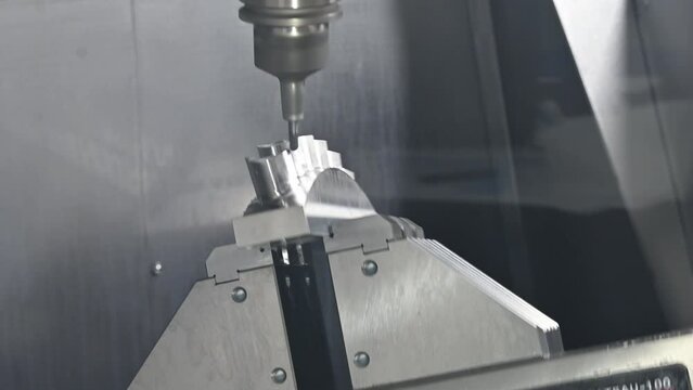The 5-axis CNC milling machine  cutting the turbine part with solid ball end mill tools.