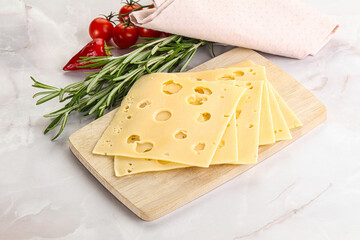 Sliced maasdam cheese with holes