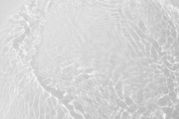 White water with ripples on the surface. Defocus blurred transparent white colored clear calm water surface texture with splashes and bubbles. Water waves with shining pattern texture background. - obrazy, fototapety, plakaty