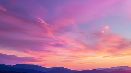 Obraz premium Vibrant sunset skies over mountain silhouette