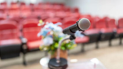 Microphone for speaker describing abstract blurs in seminar room or lectures for audiences in...