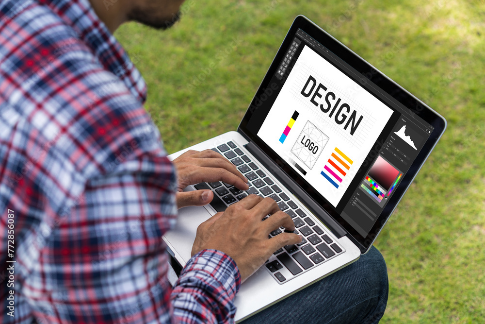 Poster graphic designer software for modern design of web page and commercial ads showing on the computer s