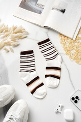 Composition with stylish socks on white background