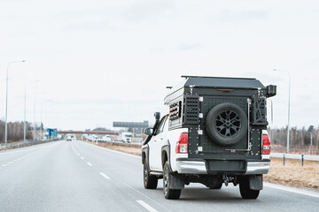 A Road Trip with a Truck Camper Equipped with Off-Road Features © AlexGo