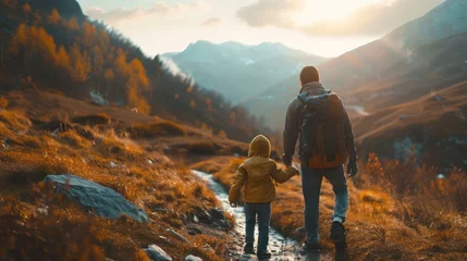 Foto op Plexiglas A father and child hiking together in the mountains.  © Borin