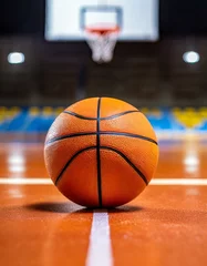 Fotobehang A basketball ball placed on the basketball court. close up © two K