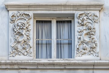 Obraz premium Architectural detail of baroque stucco decoration on window facade.
