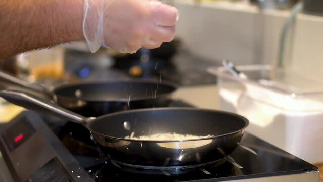 Slow motion view of adding tapioca flour to cook sandwich