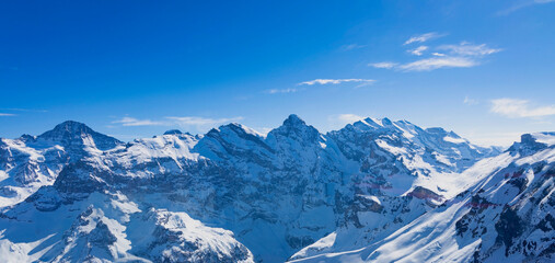 The banner mountain view of alpine as snow-capped mount peaks scene  in Winter mountains background