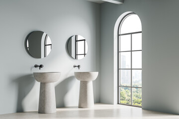 Stylish home bathroom interior with washbasins and mirrors, panoramic window