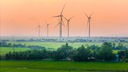 view of turbine green energy electricity, windmill for electric power production, Wind turbines generating electricity on rice field at Phan Rang, Ninh Thuan province, Vietnam