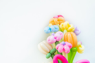 Balloons twisted into a blossoming flower bouquet on white background,Flowers Balloon to decorate the place,bouquet with colorful balloon flowers.