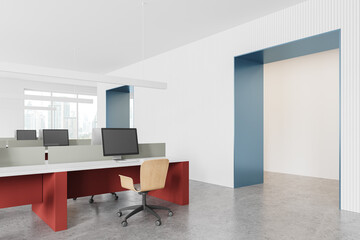 Office coworking interior with desk and pc monitors, panoramic window