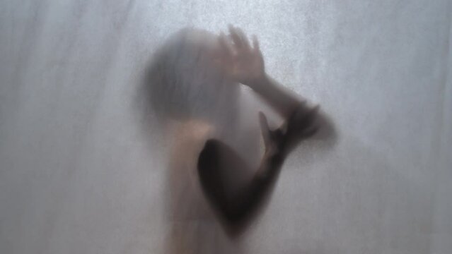 Silent Eloquence: A Dance of Hands Behind a Sheer Curtain