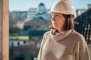 Portrait of woman architect on building construction site during inspection procedure