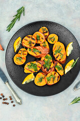 Grilled sweet potato slices. - 772922239