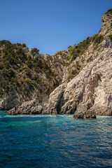 Vertical Scene of Rocky Cliff with Ionian Sea in Greece. Sea Level View of High Stone and Turquoise Water during Zakynthos Travel.