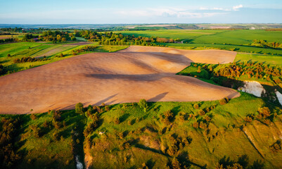Gorgeous summer scene of a rolling hills of agricultural area from a bird's eye view.