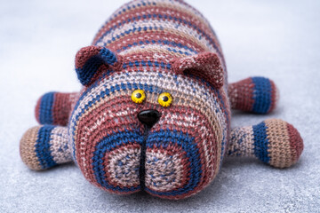 Crocheted toy cat. Melange thread. Hobby knitting. Funny animal Hook knit