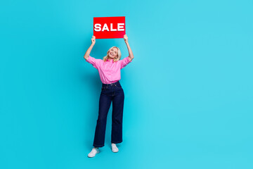 Full size photo of pretty pensioner female raise hold sale banner wear trendy pink smart casual...