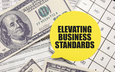Speech bubble with ELEVATING BUSINESS STANDARDS text over financial paperwork and US currency