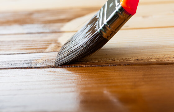 Close up of paint coating and protection of wooden surfaces