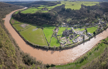 Amazing aerial panorama of Tintern Abbey, River Wye, and the nearby landscape.