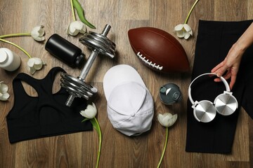 Sportswear Accessories With Flowers Wooden Background