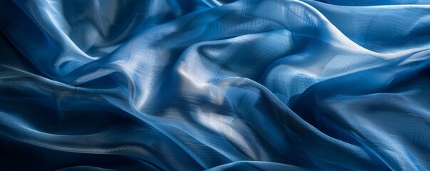 Fototapeta premium Textured blue silk fabric with waves