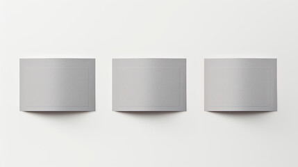 Single gray box on white wall accompanied by three square ones